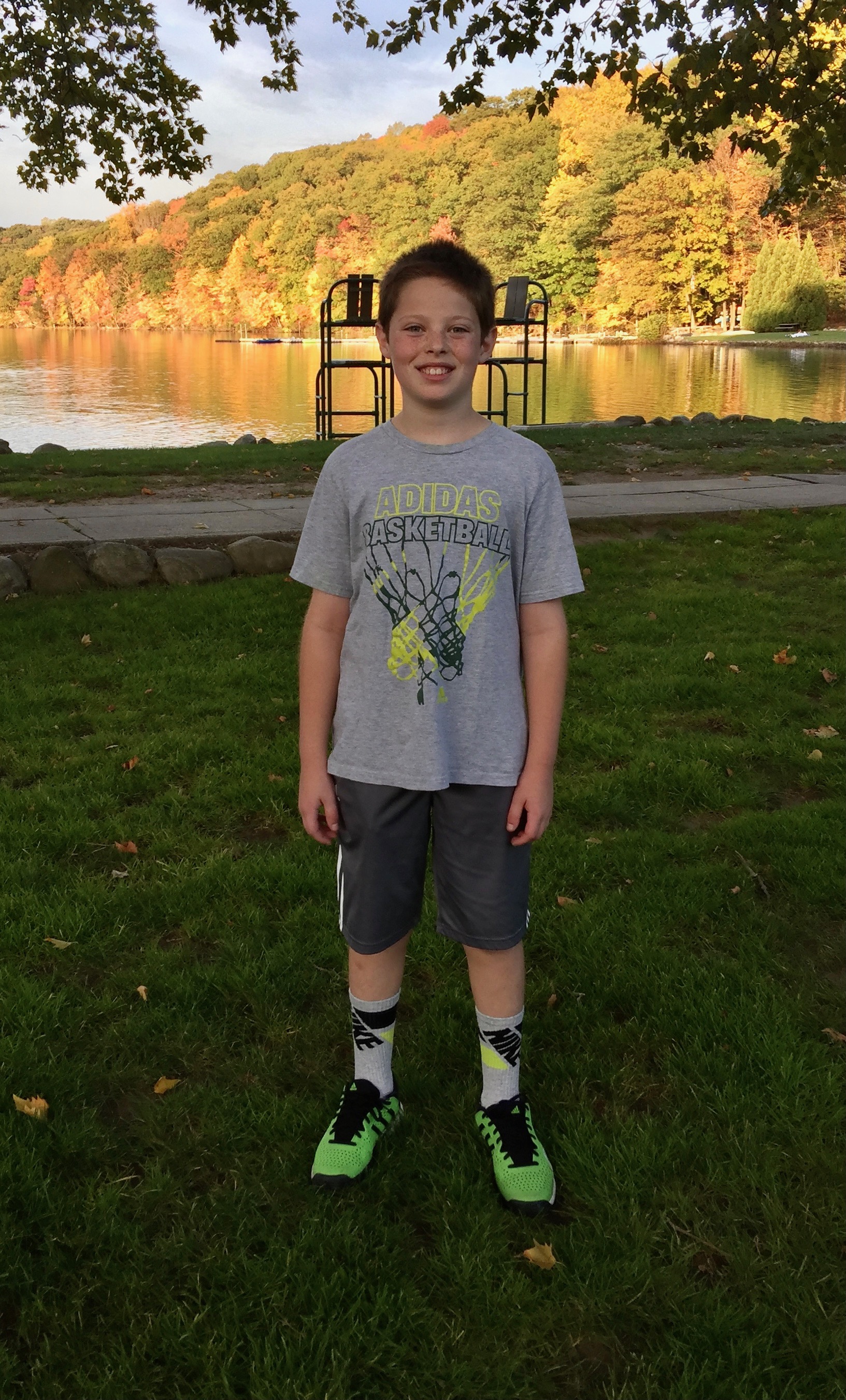 Young Jesse standing by a lake